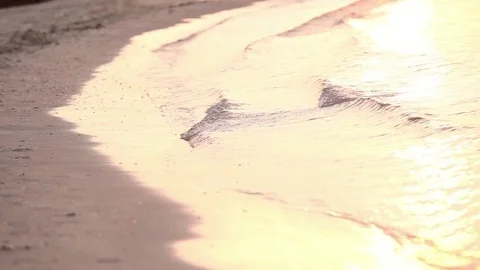 Glare of the sun at sunset on the sea waves Stock Footage