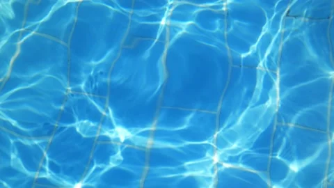 Glare of the sun on the surface of the water. pool water movement Stock Footage 162759848