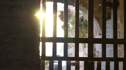 Glare of sunlight through bars  ancient gates fortress Stock Footage 42139733