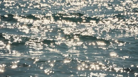 Glare of sunlight on the water surface. Reflection of light on the sea waves. Stock Footage 108524549