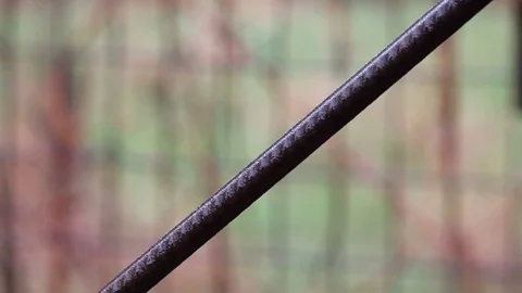 Glare from the water flowing down the pipe during the rain Video stock 76464631