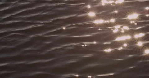 Glare on the water from the sun Stock Footage 75312492