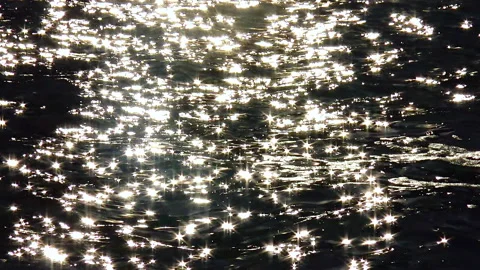 Glare on the water, sun reflection on the water on the sea Stock Footage 229893555