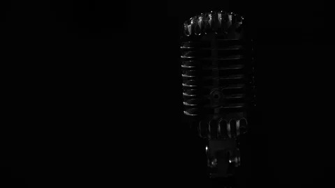 Glare of white light flickers and shine on a chrome retro mic on dark background Stock Footage 118528305