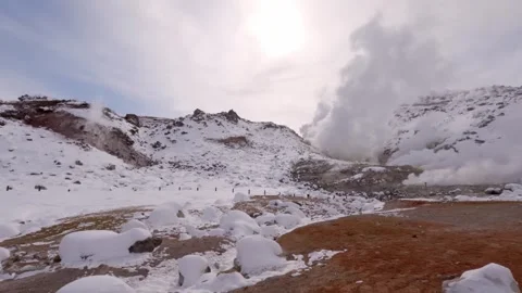 Glaring sun behind clouds of steam in volcanic landscape Stock Footage 245794023