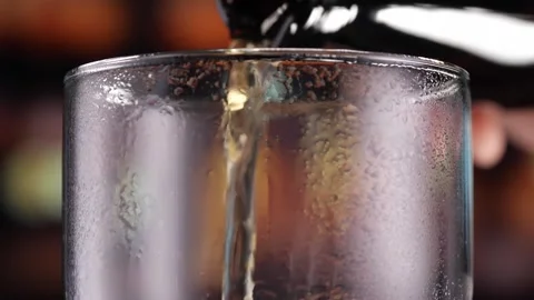Glas of Beer with Snacks and Chips in alcoholic bar, forming bubbles and a Stock Footage 265256970