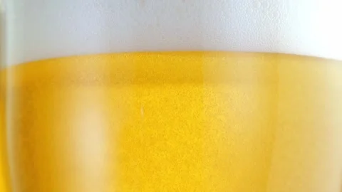 Glas of Beer with Snacks and Chips in alcoholic bar, forming bubbles and a Stock Footage 265256990