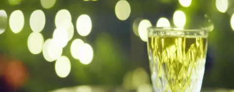 A glass of alcohol on the background of oval side flashing lights Stock Footage 313845830
