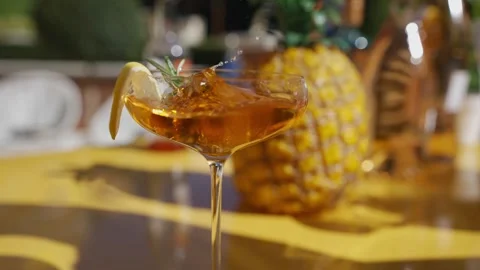 A glass of alcohol with a slice of lemon in it Stock Footage 297870945