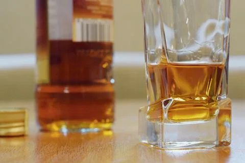 Glass of alcohol on the table, dependency concept Stock Photos