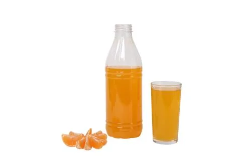 Glass and a bottle of orange juice isolated on white background Stock-Fotos