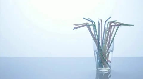 Glass and drinking straws, stop motion Stock Footage 11899701