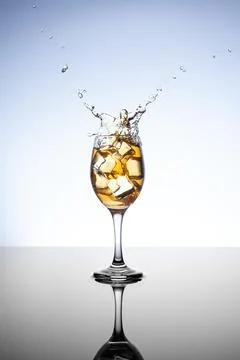 Glass and Ice cube with reflection Stock-Fotos