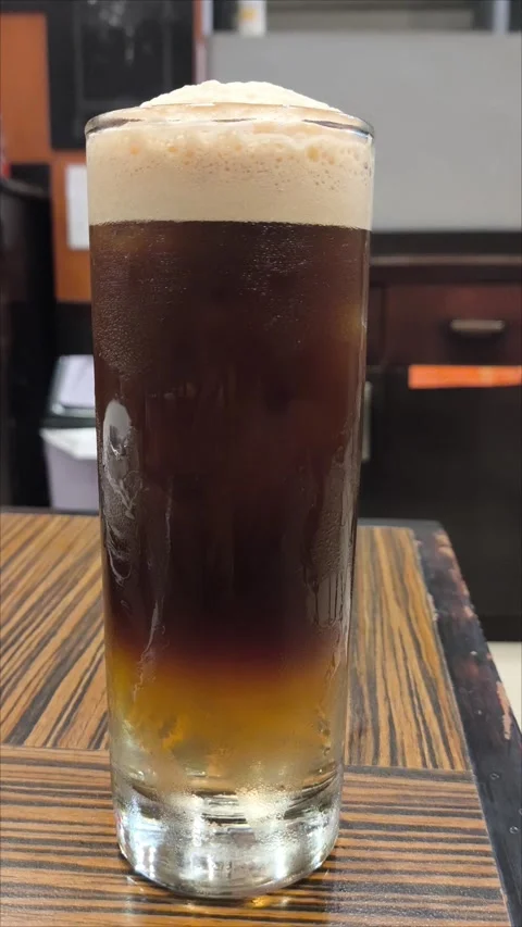 Glass and mug of beer on table with foam and froth Stock Footage 296903536