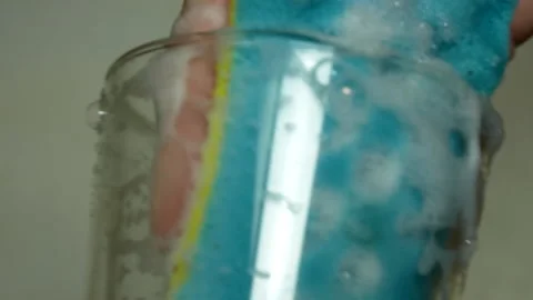 Glass and sponge with soapy foam Stock Footage 188049970