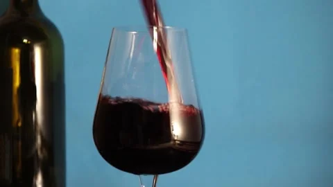  Glass on the Background of a Bottle of Red Wine. Stock Footage 170383639