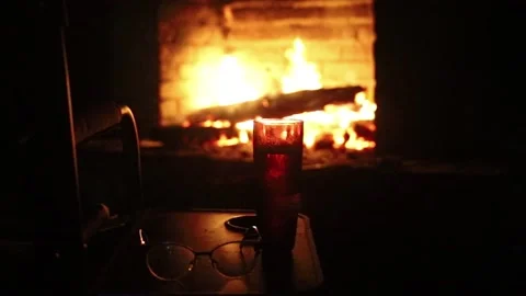 Glass On The Background Of The Fireplace in full darkness Stock Footage 157185404