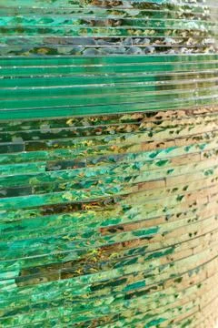 Glass background with stripe pattern in hue of green color. Stock Photos