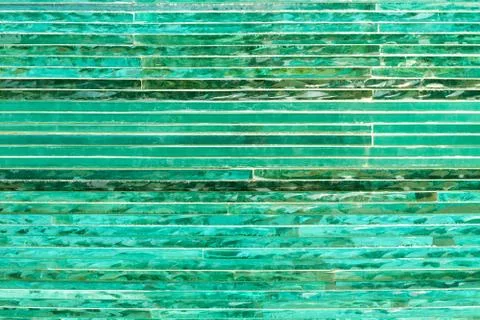 Glass background with stripe pattern in hue of green color. Stock Photos