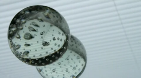 Glass ball on a light surface Stock Footage 671337