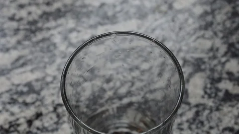 Glass beaker cup being filled with water until liquid overflows 스톡 동영상 114122095