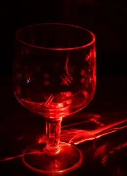 Glass beaker in laser light Stock Photos