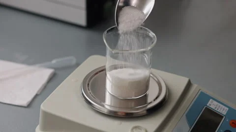 Glass beaker, sugar experiments, precision weighing Stock Footage 293490494