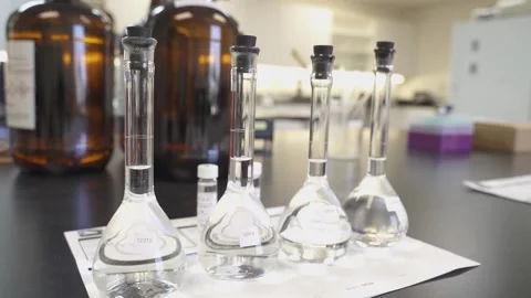 Glass beakers in science lab Stock Footage 151808084