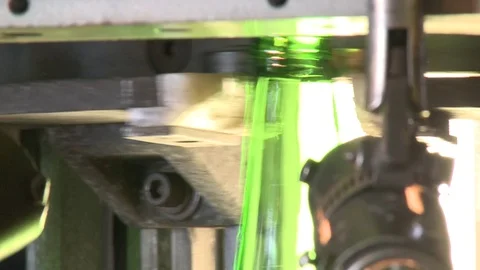 Glass beer bottles incandescent in production line slow motion Stock Footage