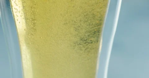 Glass of beer with bubbles against white background Stock Footage 99732183