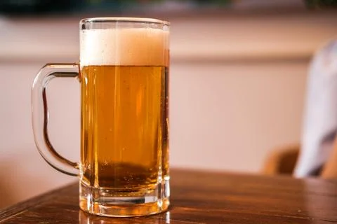 A glass of beer in cafe Stock Photos