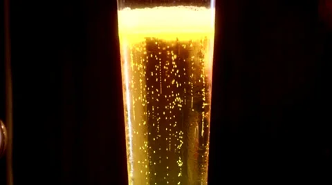 Glass of beer in dark Видео 36790271