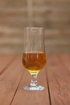 A Glass of Beer on Pub Table Stock Photos