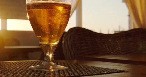 A glass of beer in the sunset rays Stock Footage 227009749