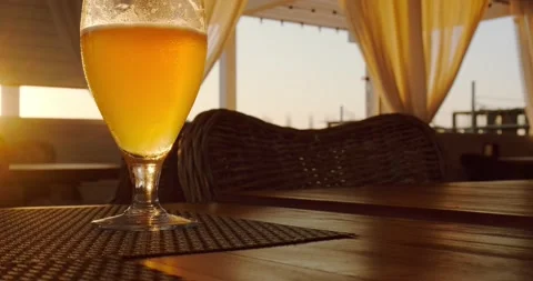 A glass of beer in the sunset rays Stock Footage 227010575