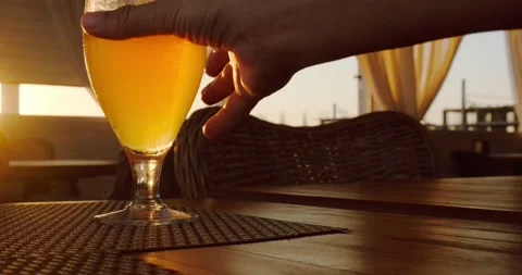 A glass of beer in the sunset rays Stock Footage 227011357