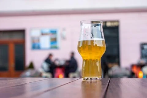 Glass of beer on table edge Stock Photos