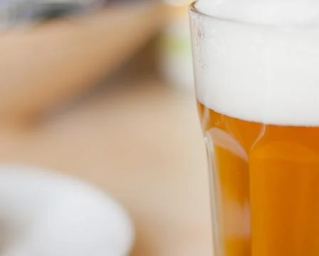 Glass of beer on table Stock Photos