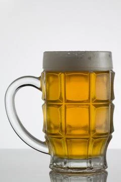 Glass of beer on white background Stock Photos