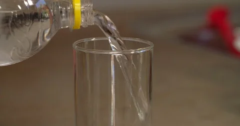 Glass being filled with bubbling soda beverage Stock Footage 89502014