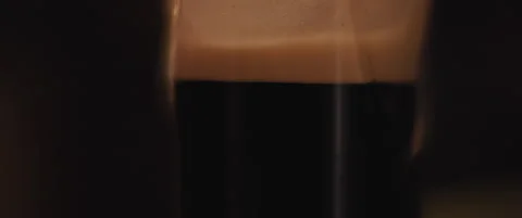 A glass of black stout beer Stock Footage 150835149