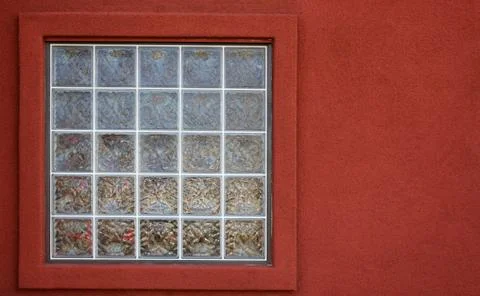 Glass block window red wall Stock Photos