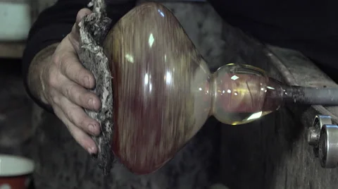 Glass-blower working in his workshop Video stock 58213919