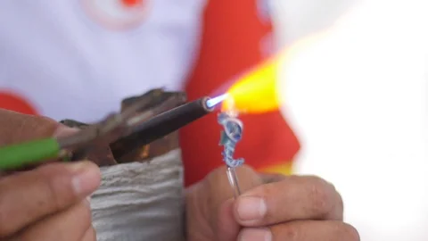Glass Blowing Artist making a Tiny Sea Horse Stock Footage 118547087