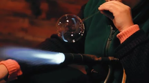 Glass blowing creates a Christmas tree ball Stock Footage 226971237