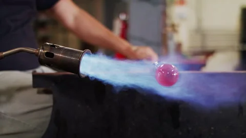 Glass blowing in a studio Stock Footage 138405117