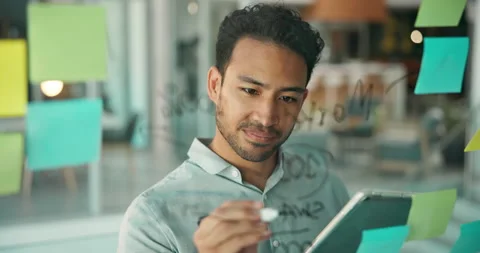 Glass, board and man writing with tablet in office for brainstorming, online Stock Footage 321361132