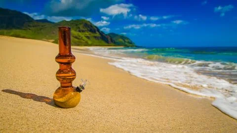 Glass bong on shore Stock Photos