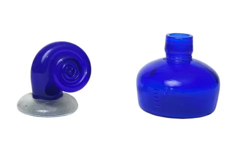 Glass bottle and a snail on a white background Stock Photos