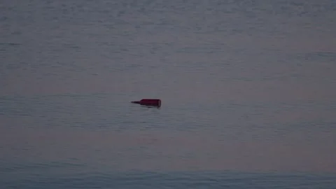 Glass Bottle Floating in Ocean 動画素材 251806674
